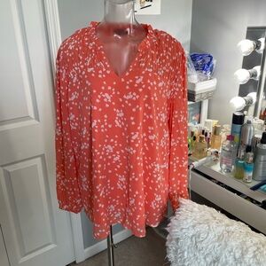 Elegant Coral Blouse with White Floral Design
